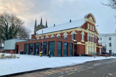 building with snow outside and on the roof